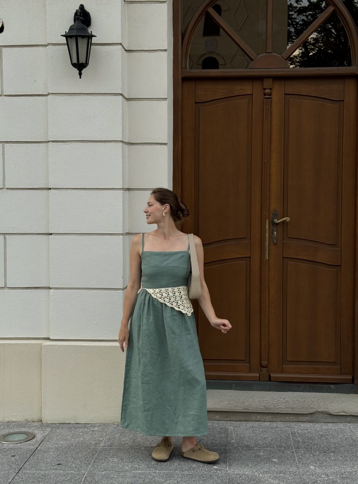 Minimalist green linen dress with open back, flowy midi silhouette, natural fabric summer dress for vacation, picnic, and resort wear