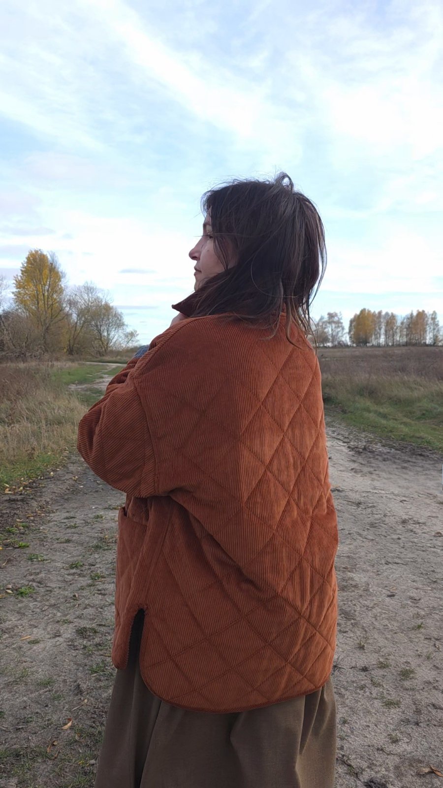 Eco friendly women’s quilted jacket made from corduroy, warm rust color, casual fall outfit