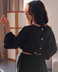 Black linen blouse with puff sleeves, elasticated hem, and coconut buttons on the back, handmade and stylish