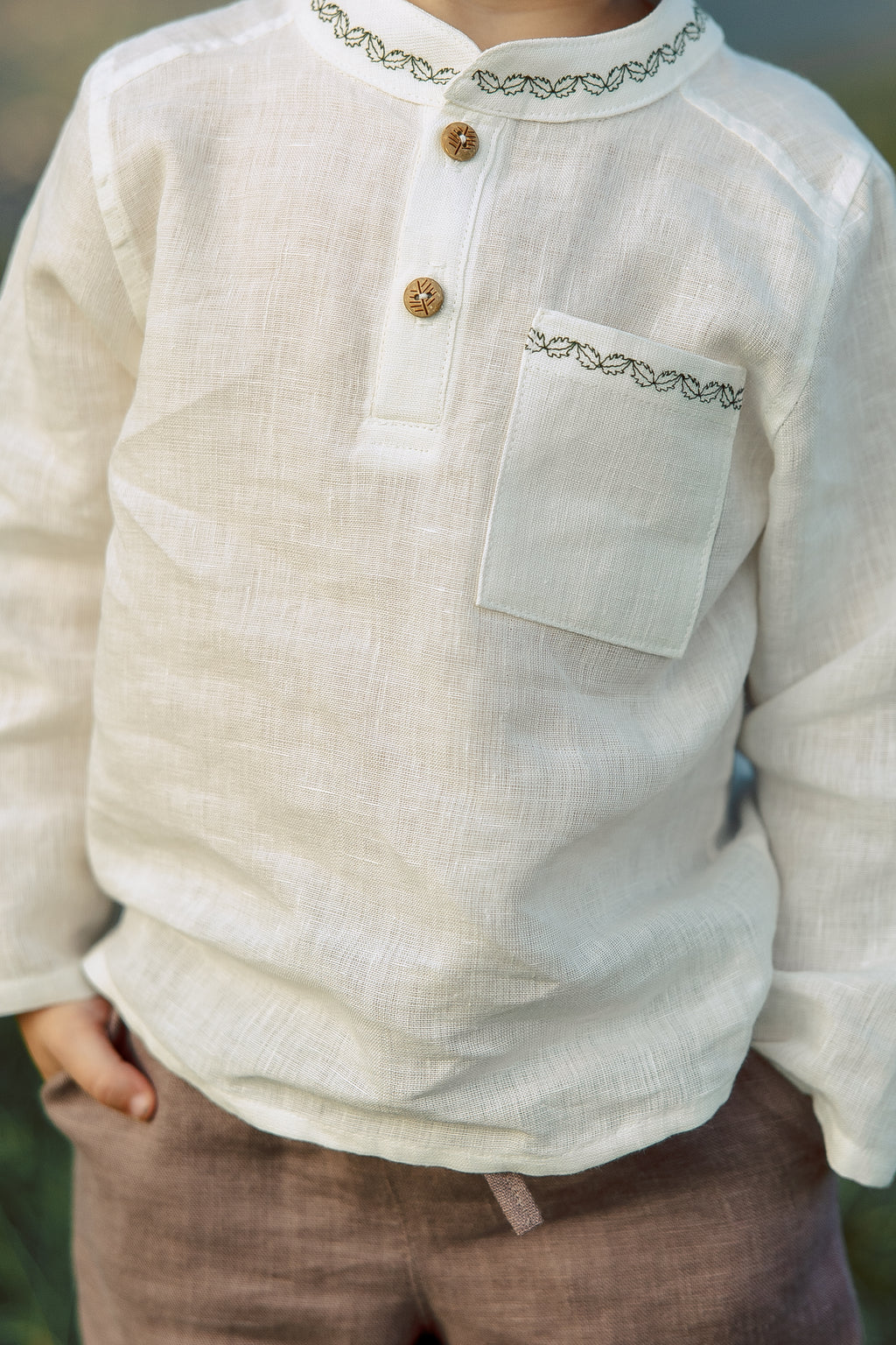 White boys’ shirt made of 100% softened linen, handmade embroidery details, perfect for formal events and casual wear.