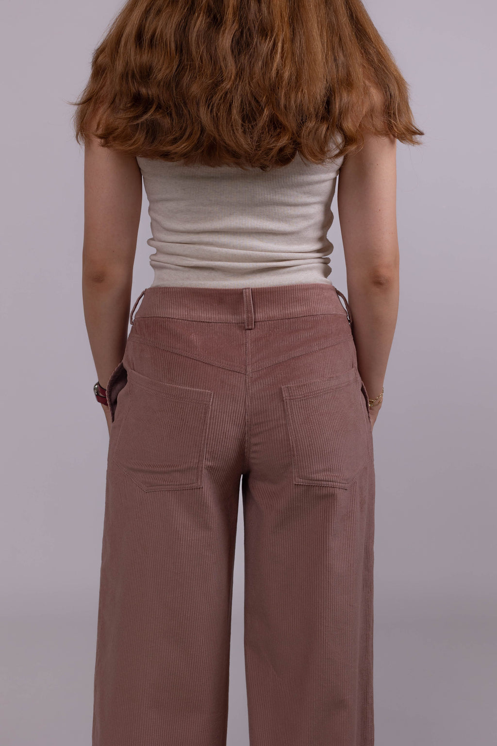 Women’s corduroy pants in medium-wale cotton, straight wide-leg silhouette with side and back pockets.