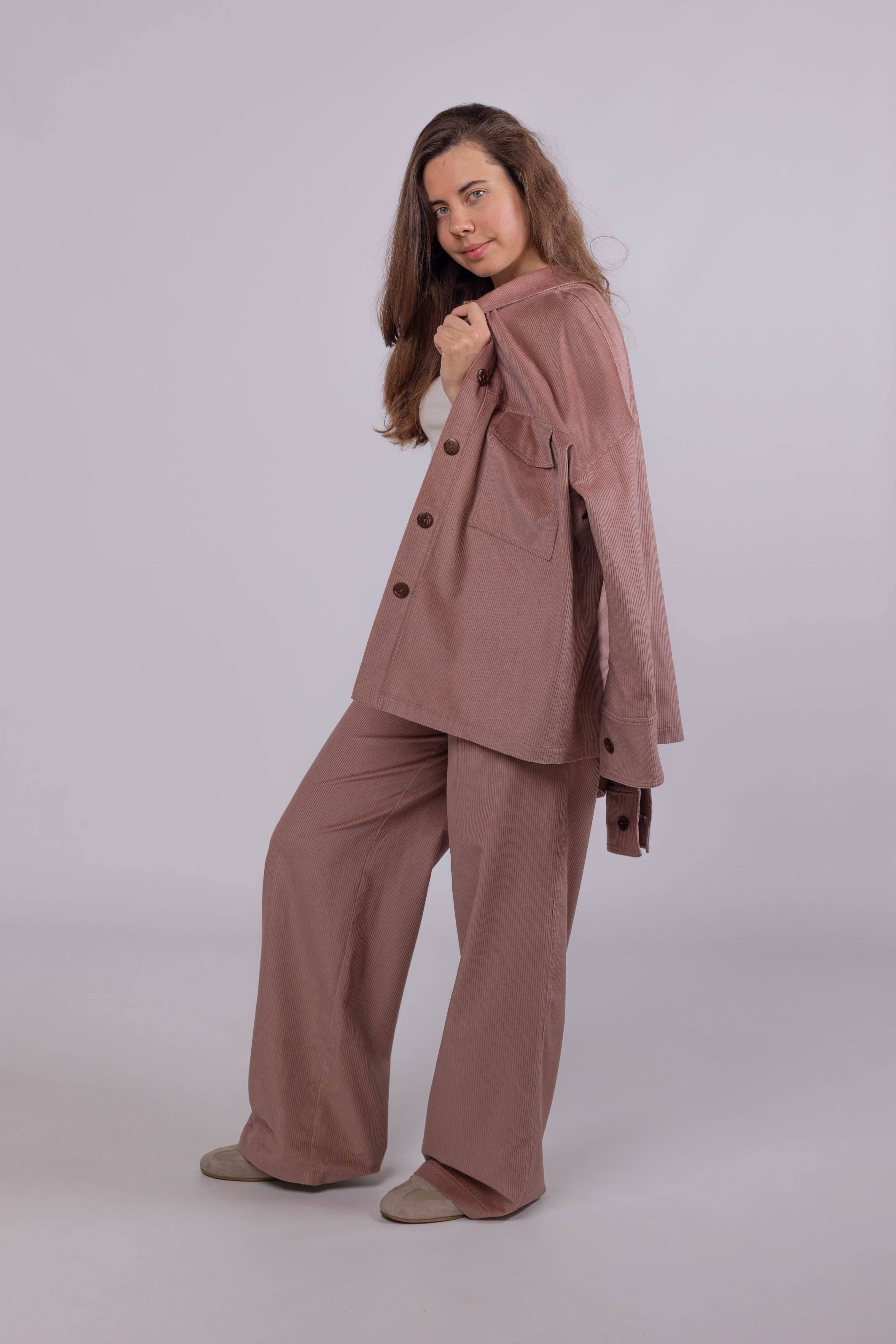 Stylish women’s cotton corduroy trousers in powder pink, perfect for everyday wear and layering outfits.
