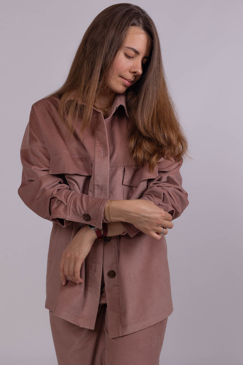 Soft cotton corduroy shirt jacket for women, oversized fit, powder pink color, ideal for casual and office wear.