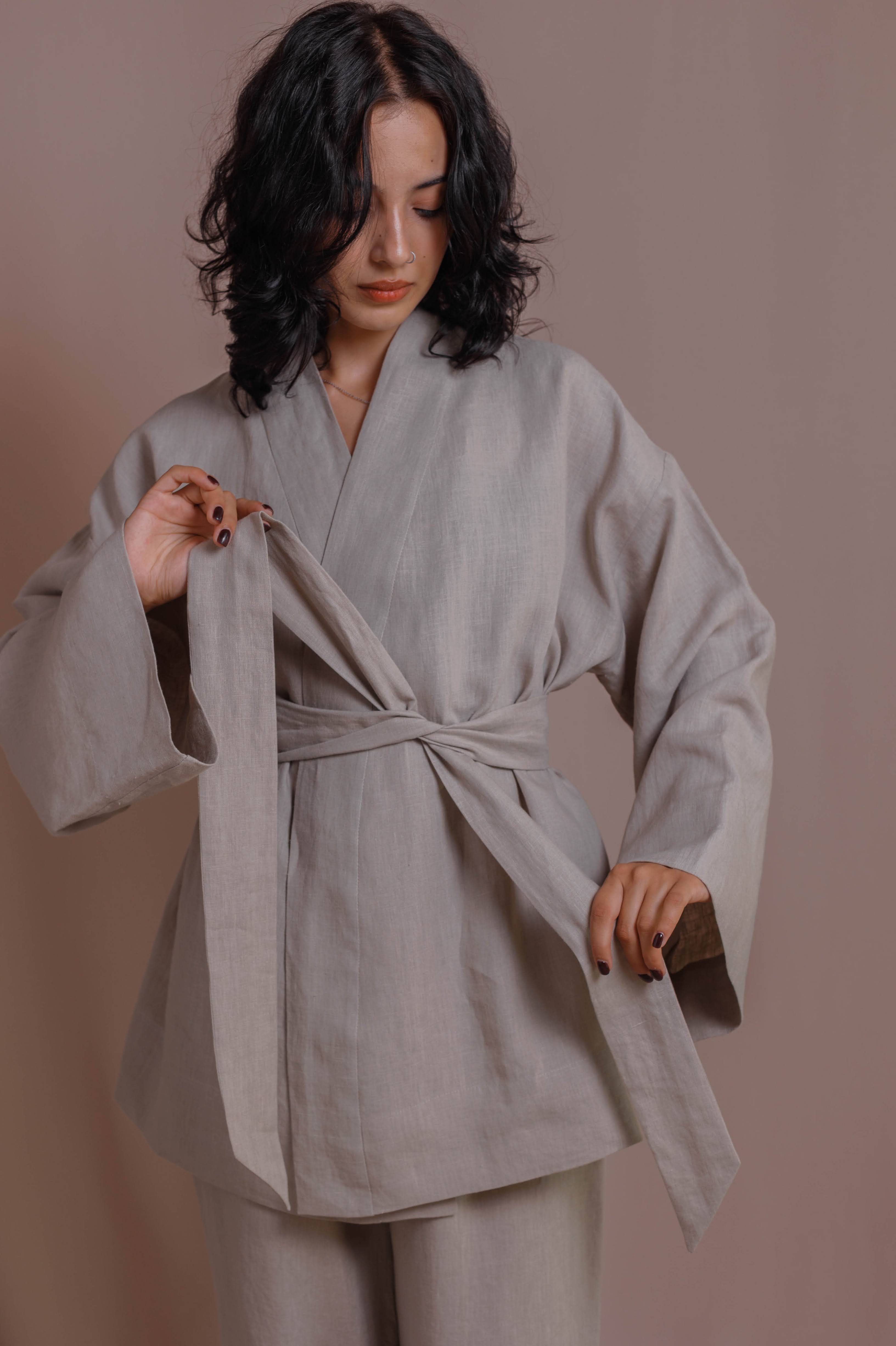 Light gray boiled linen kimono with wide sleeves displayed on neutral background.