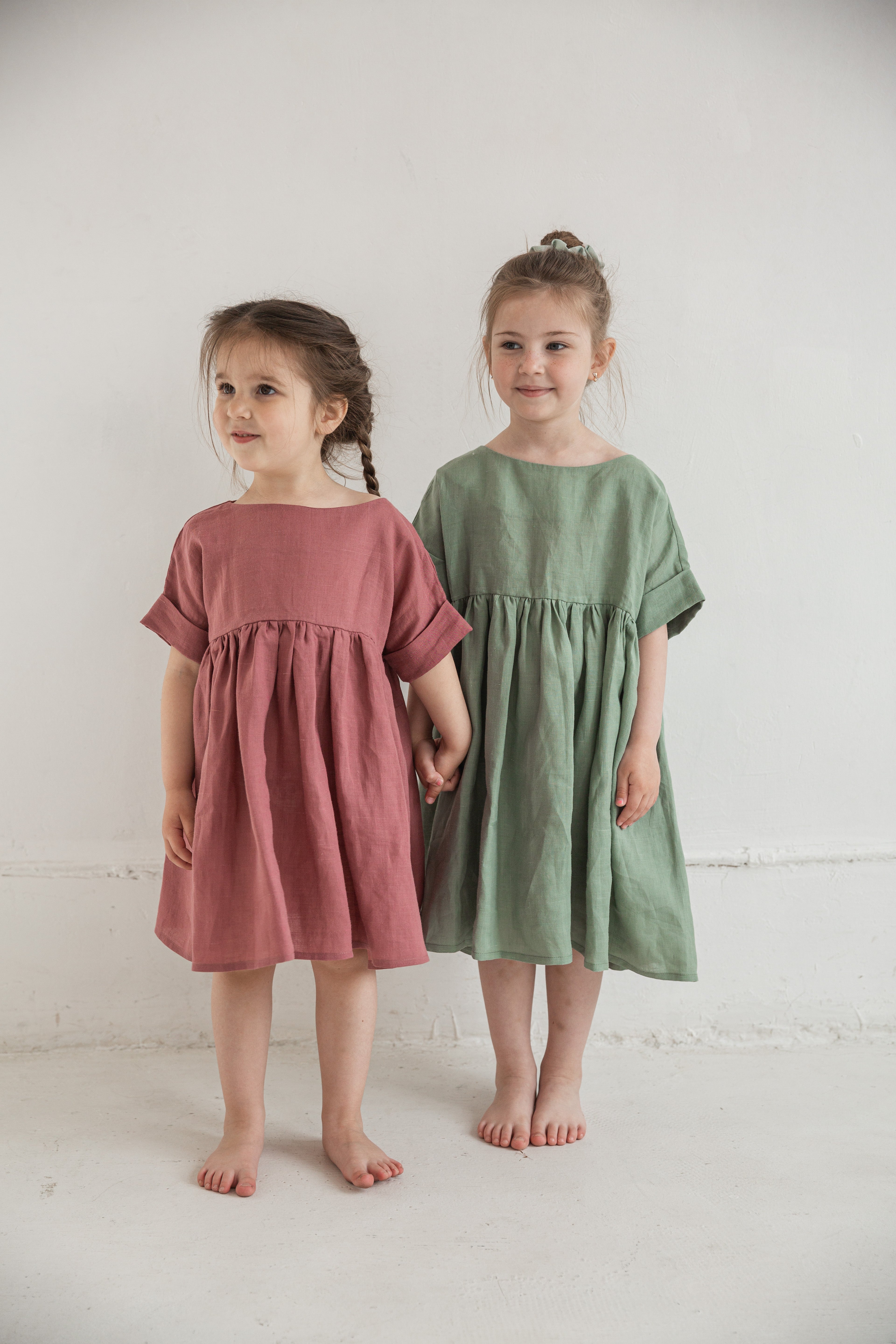 Eco conscious kids fashion, girl wearing a simple ramie dress made of nettle fabric