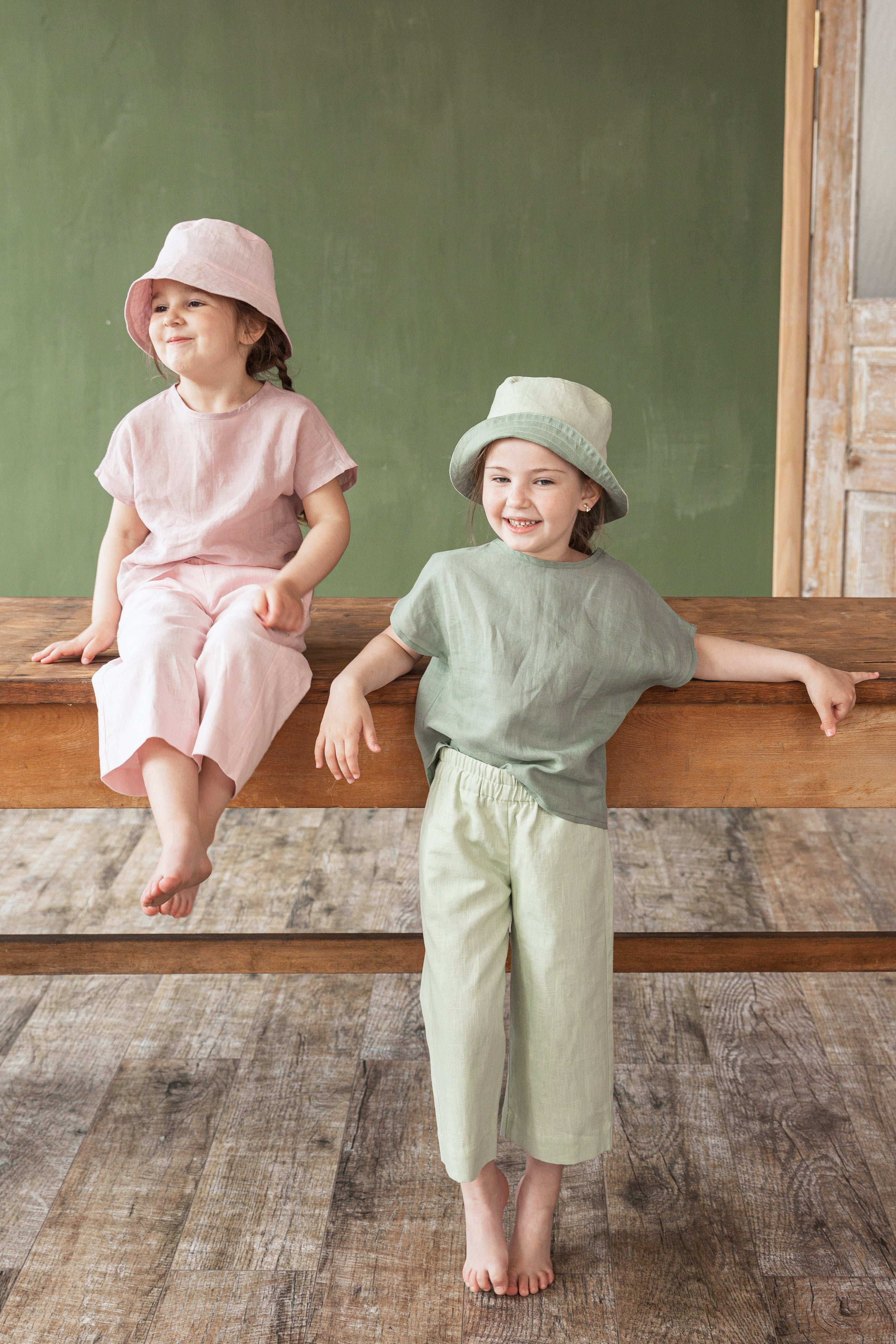 Girls wearing 100% nettle fabric ramie culottes with wide legs and elastic waistband.