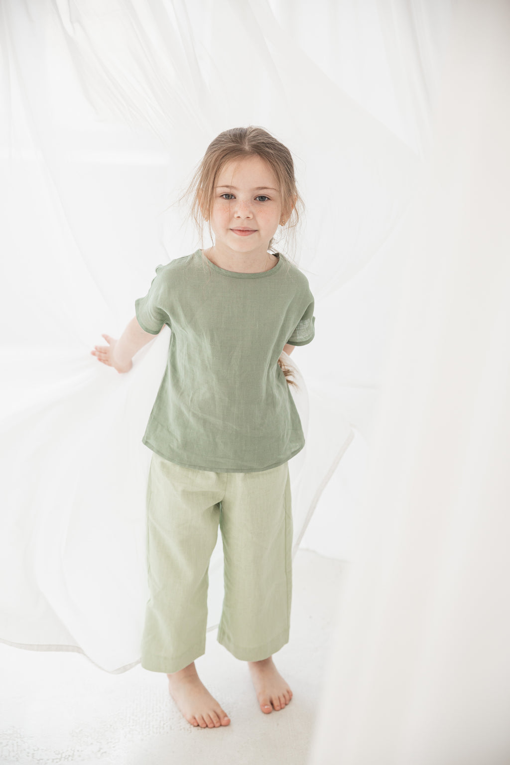 Girls wearing 100% nettle fabric ramie culottes with wide legs and elastic waistband.