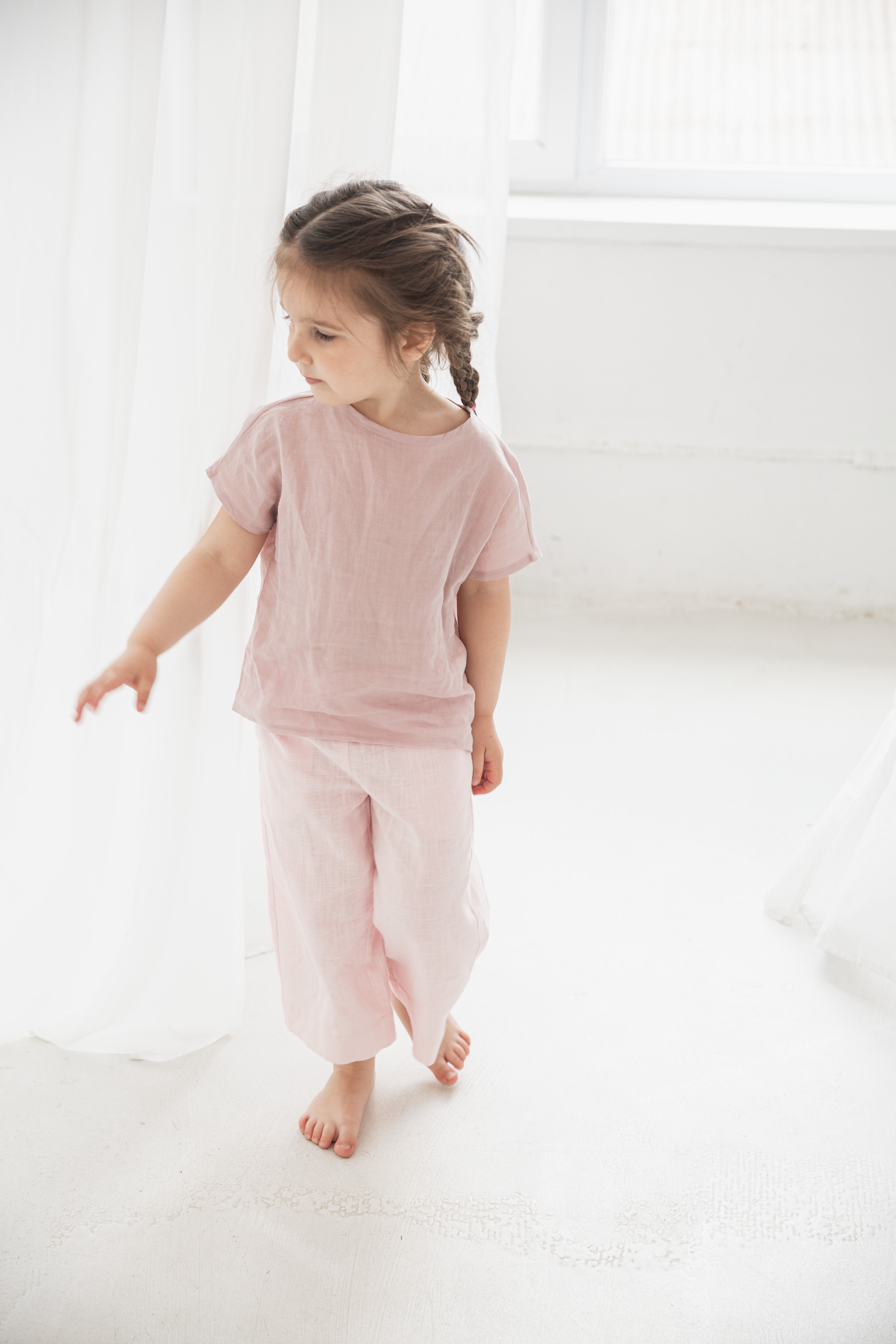Eco-friendly children’s pants in natural color, perfect for summer outings.