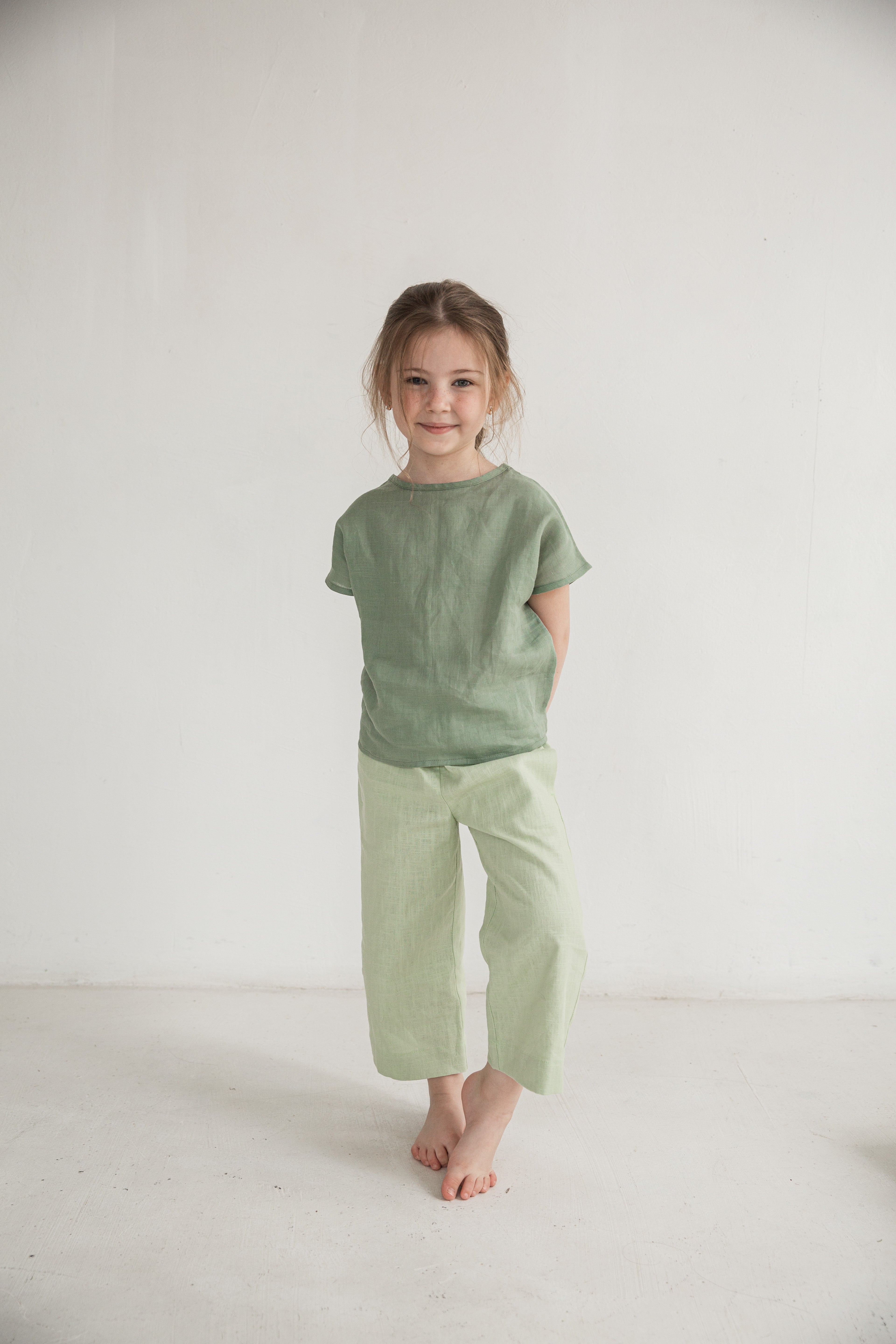 Eco-friendly children’s pants in natural color, perfect for summer outings.