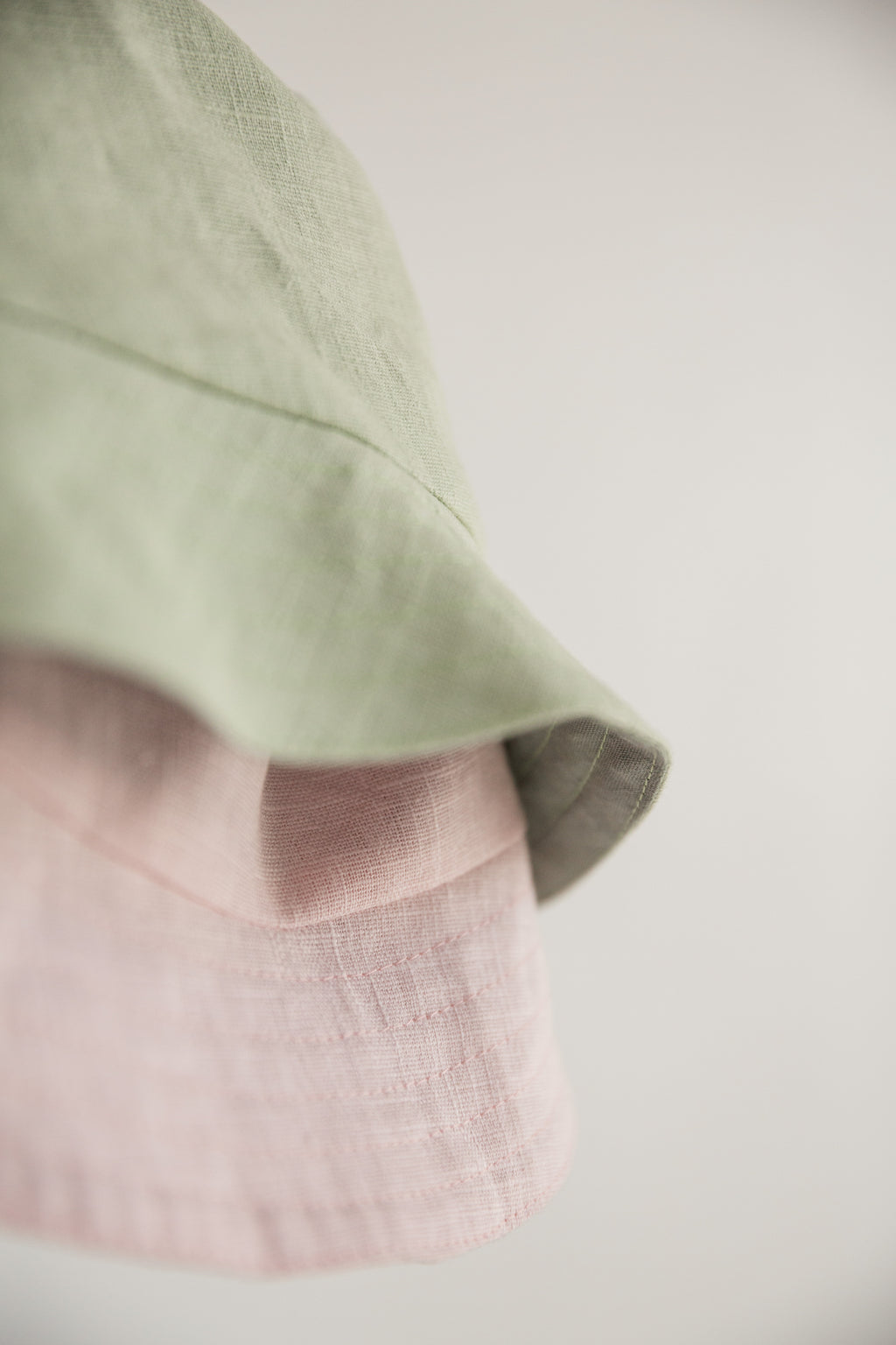 Natural linen beach hat for kids shown in studio light