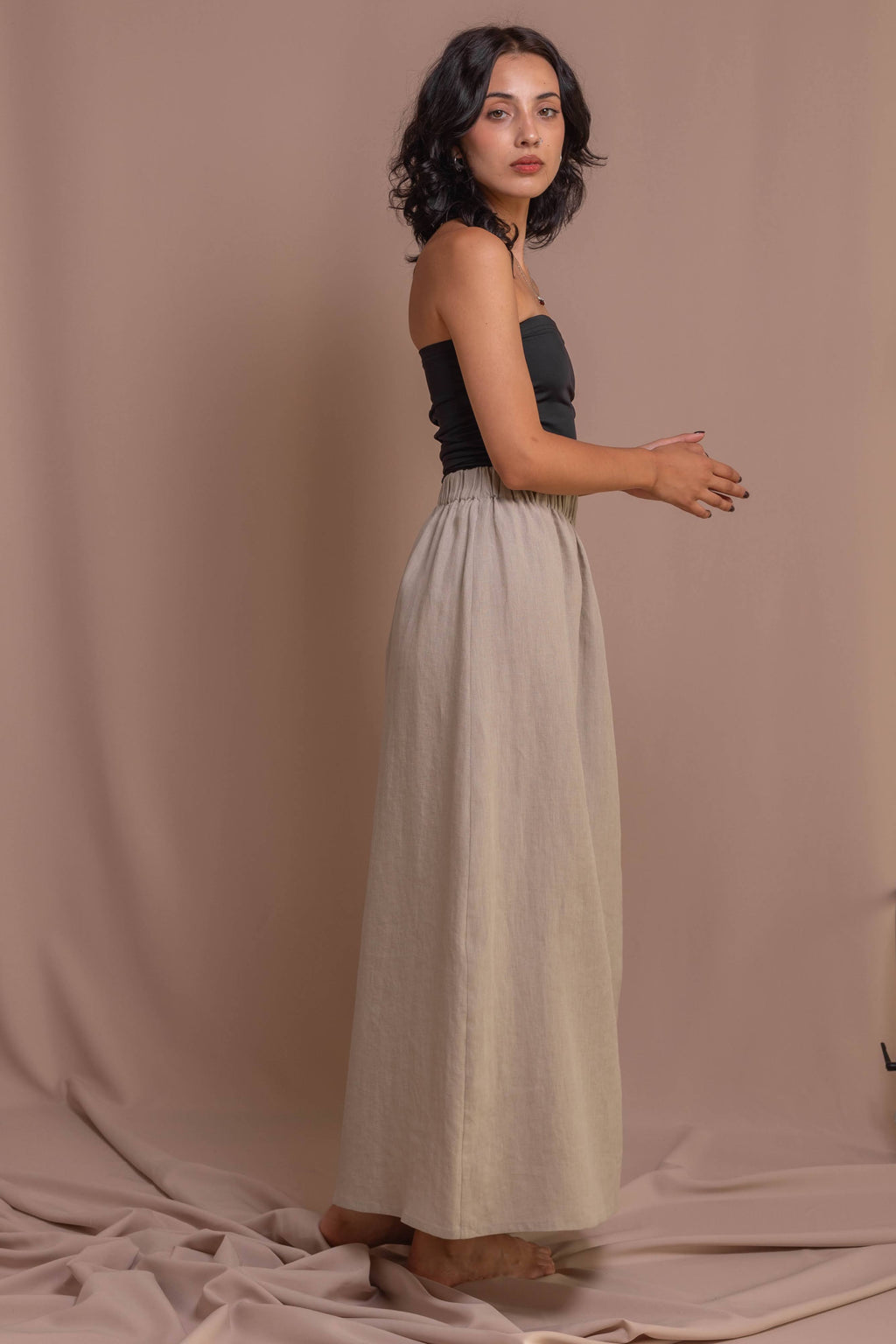 Handcrafted grey A-line skirt in 100% linen, elastic waistband, front slit for ease of movement, versatile for casual or formal wear
