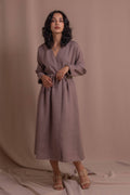 Wrap dress made from 100% softened linen with long sleeves and adjustable waist tie