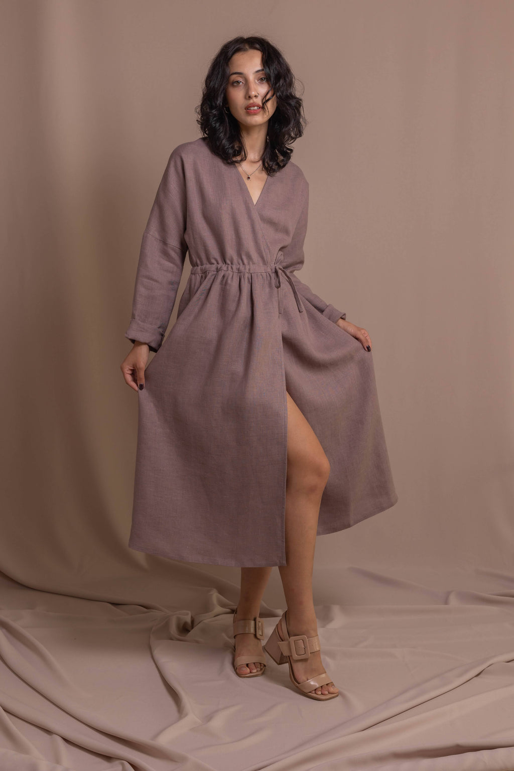 Softened linen wrap dress with long sleeves styled for everyday wear