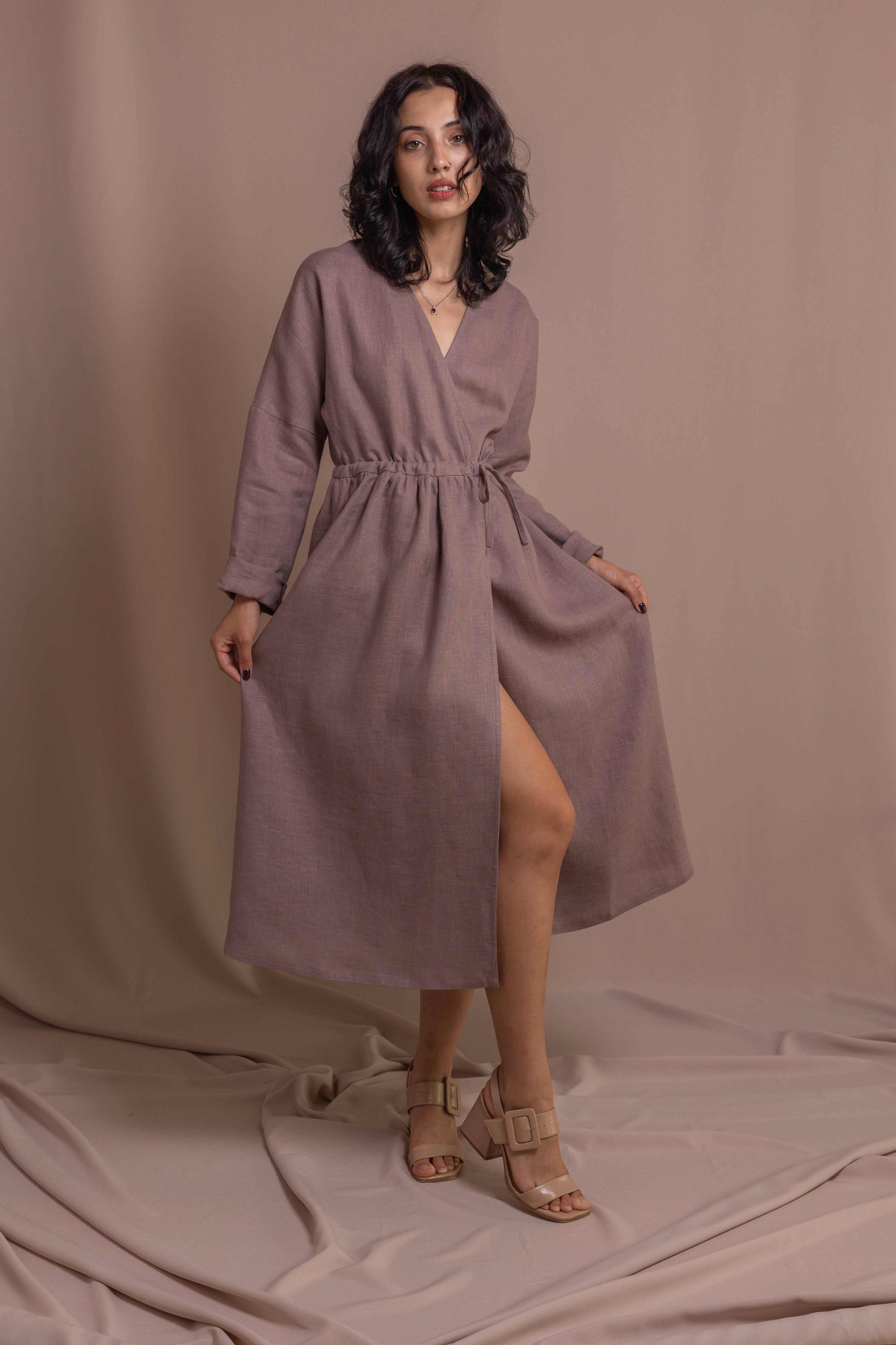 Softened linen wrap dress with long sleeves styled for everyday wear