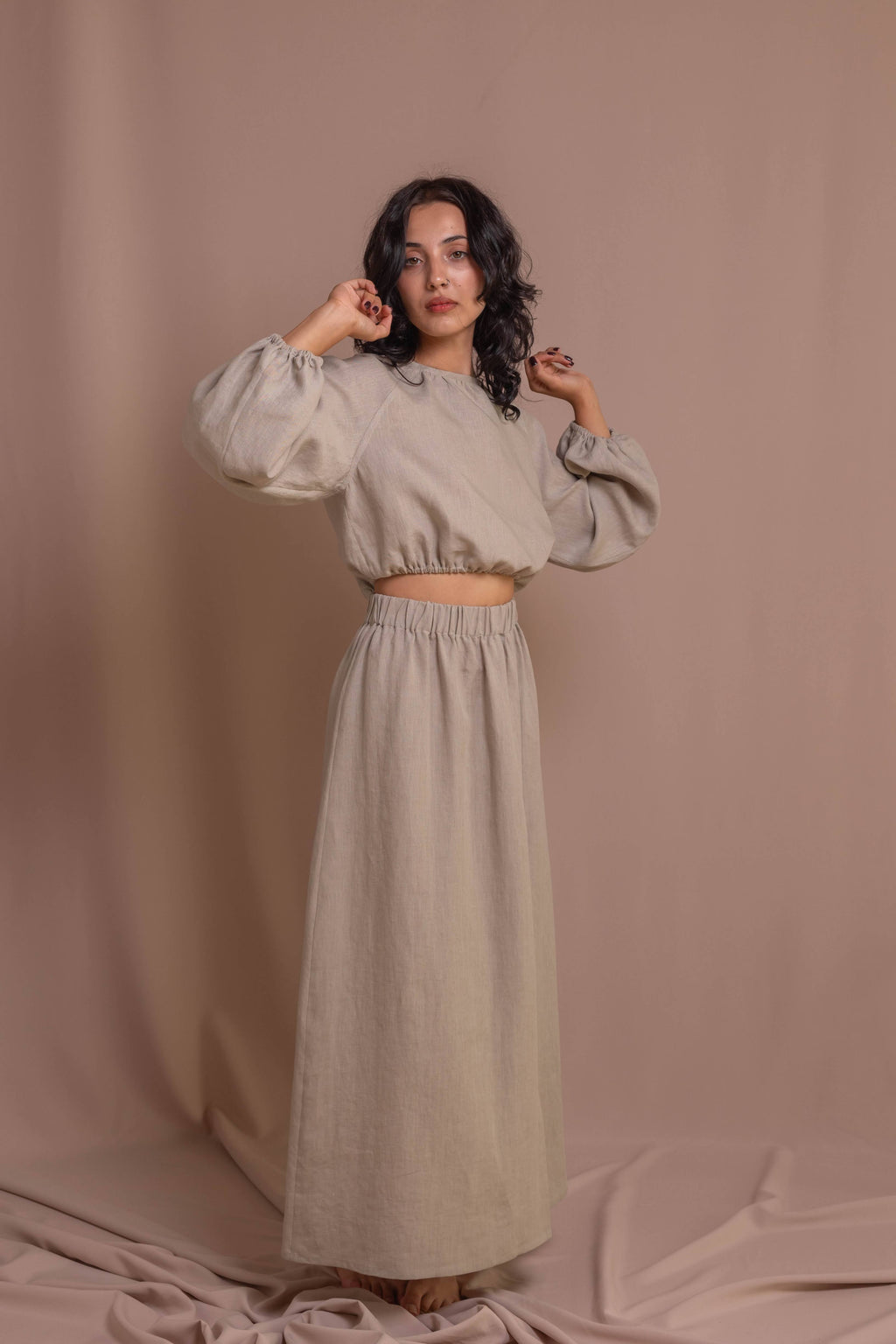 Elegant linen blouse for women, breathable fabric, soft elastic waist, and decorative back buttons, perfect for casual or formal wear.