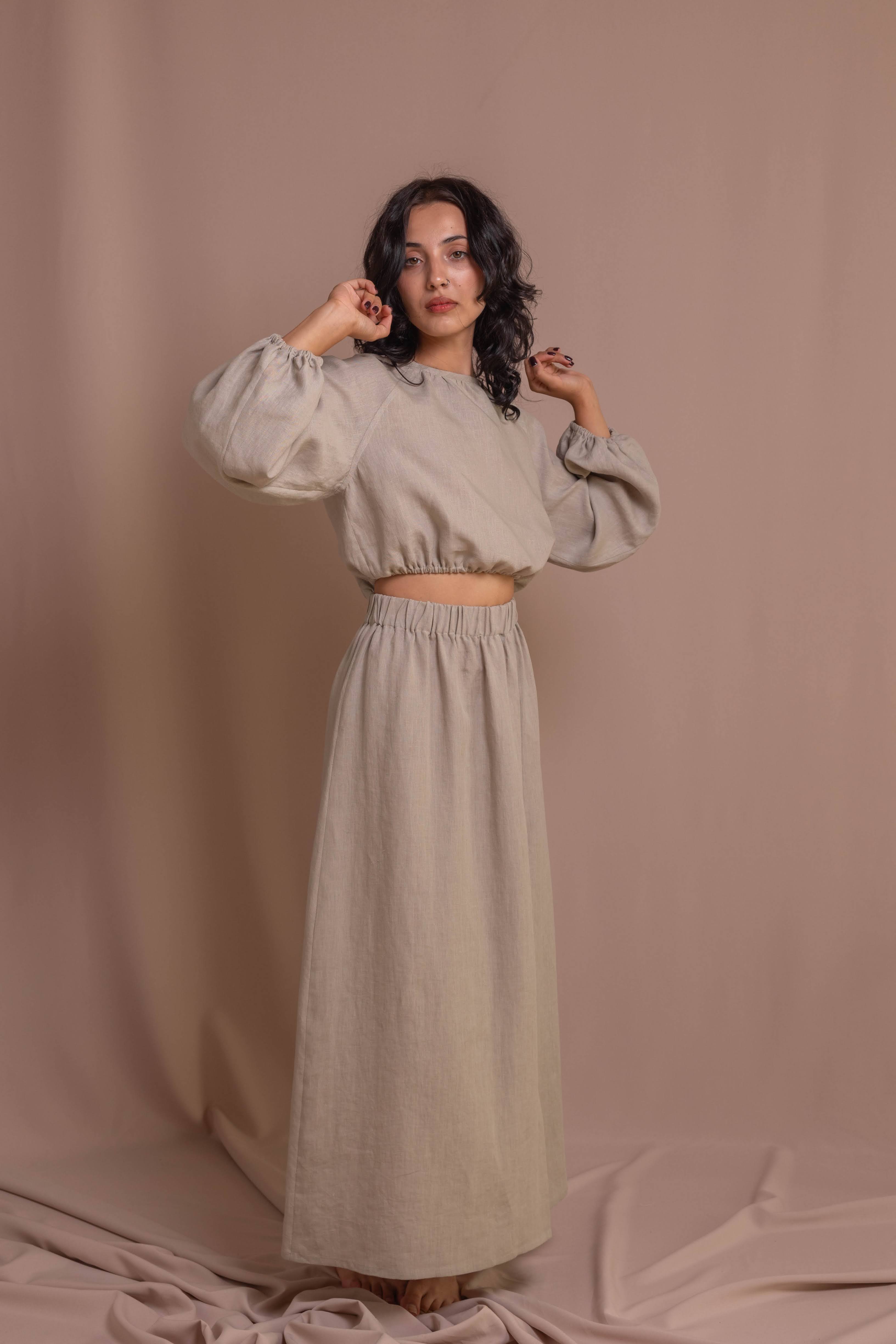 Elegant linen blouse for women, breathable fabric, soft elastic waist, and decorative back buttons, perfect for casual or formal wear.