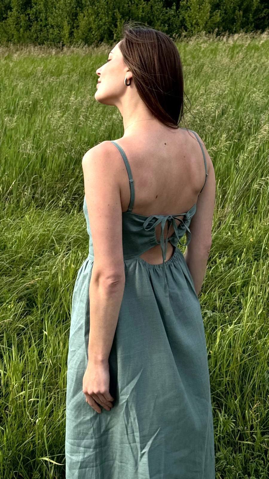 Back view of linen summer midi dress with adjustable tie-back, open back design, lightweight natural fabric dress for hot weather and beach vacation