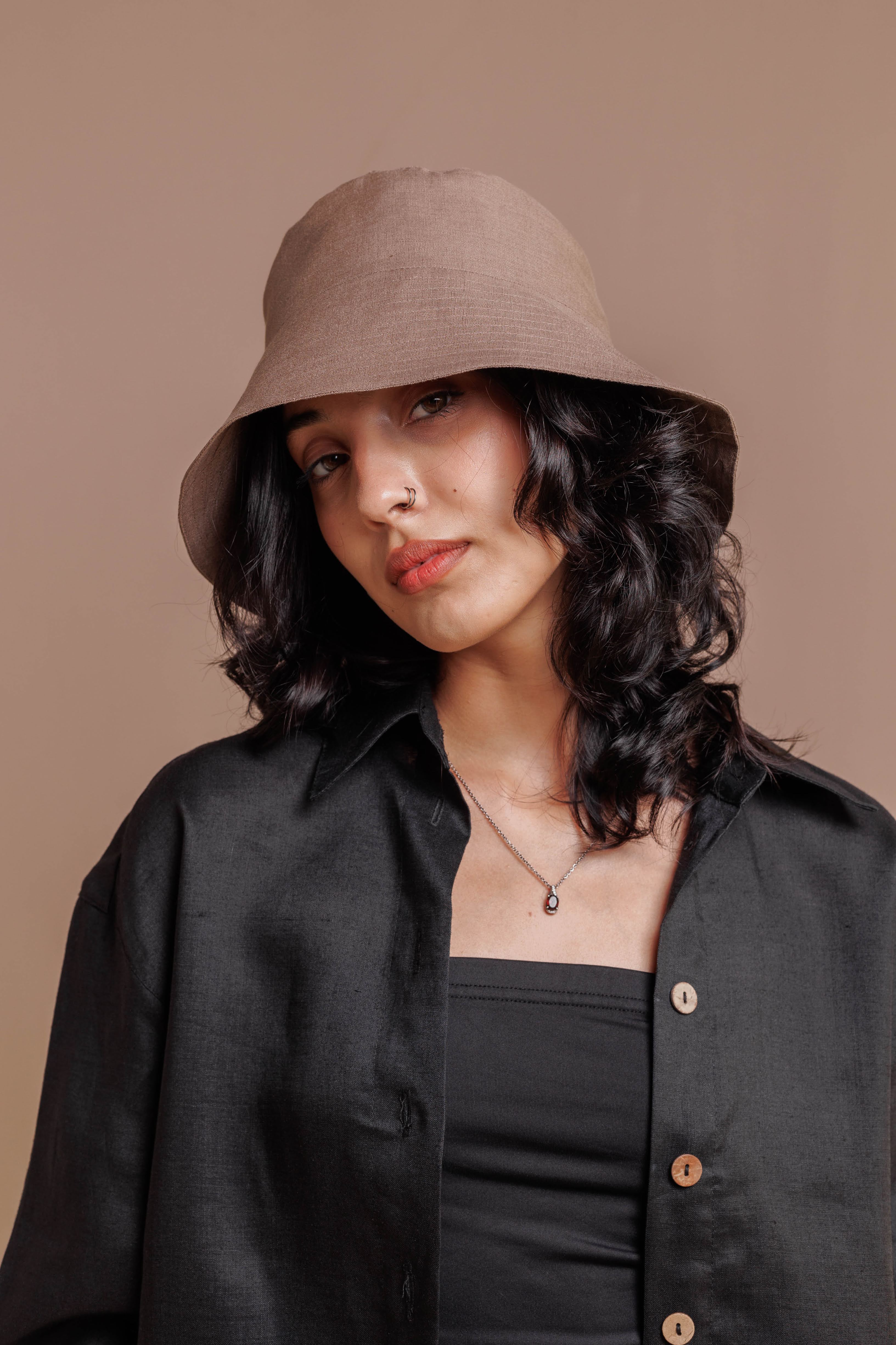 Women’s linen bucket hat in natural fabric, designed for comfortable sun protection