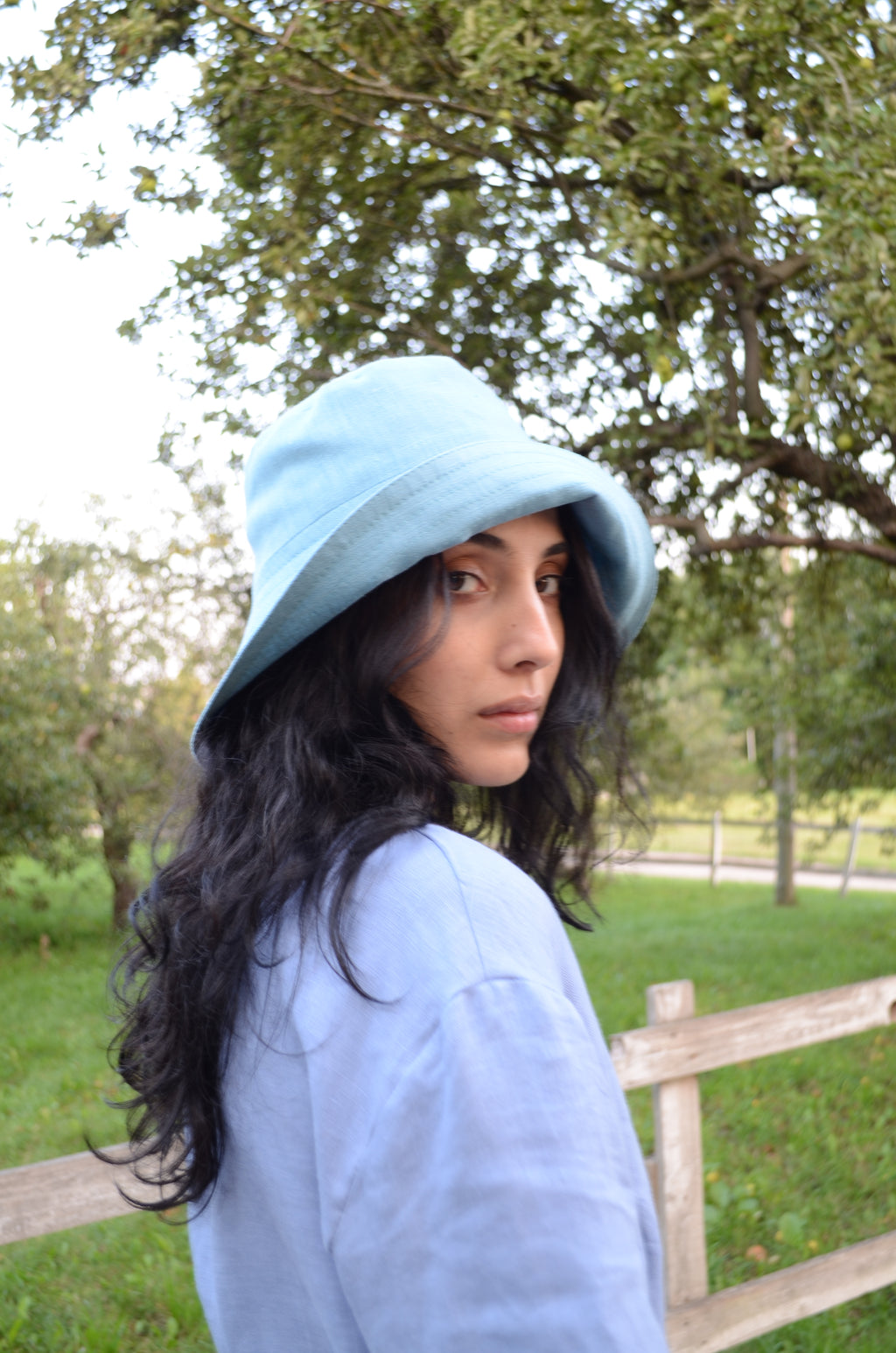 Handmade linen bucket hat with extended brim, elegant and practical summer accessory