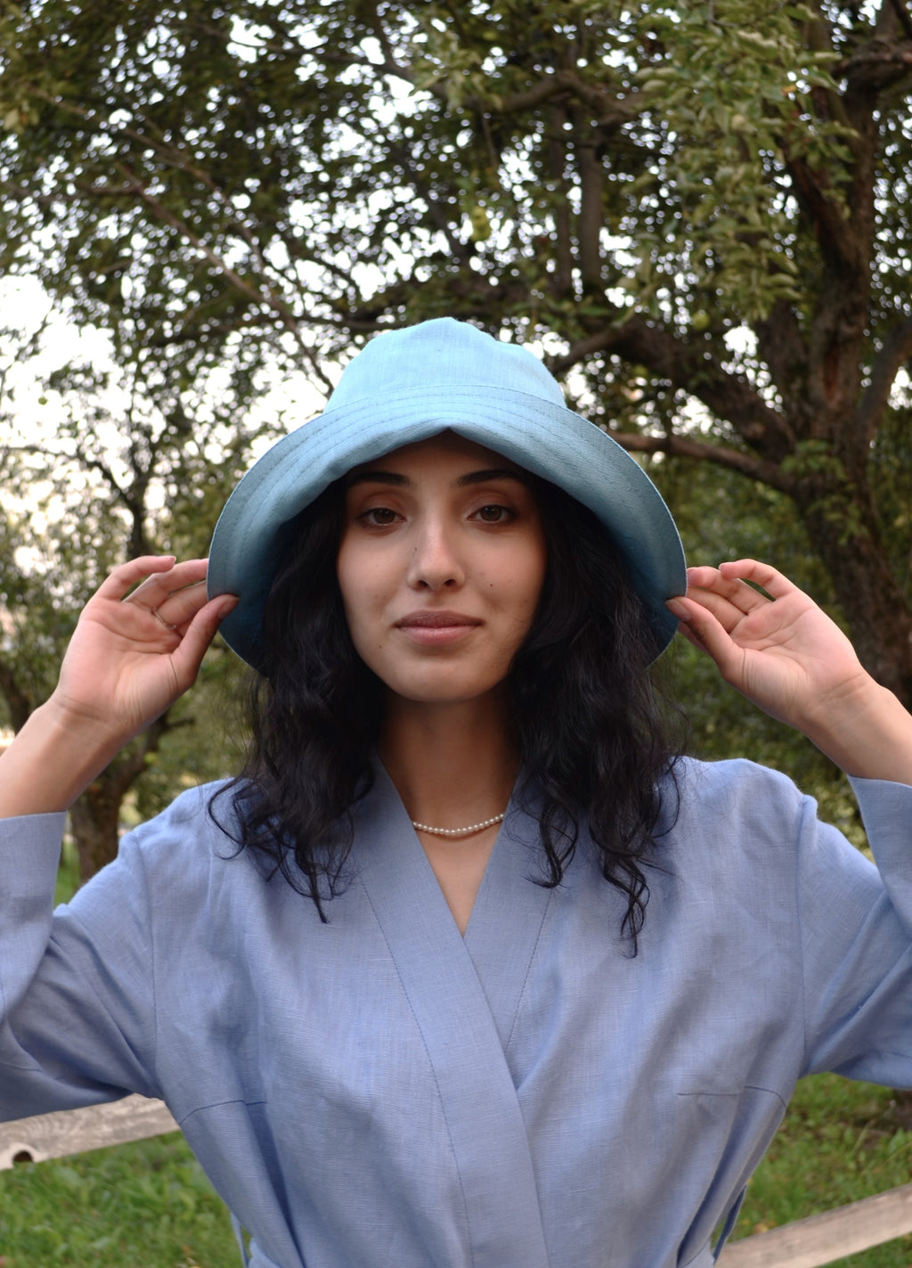 Lightweight linen panama bucket hat in natural color, offering stylish sun protection