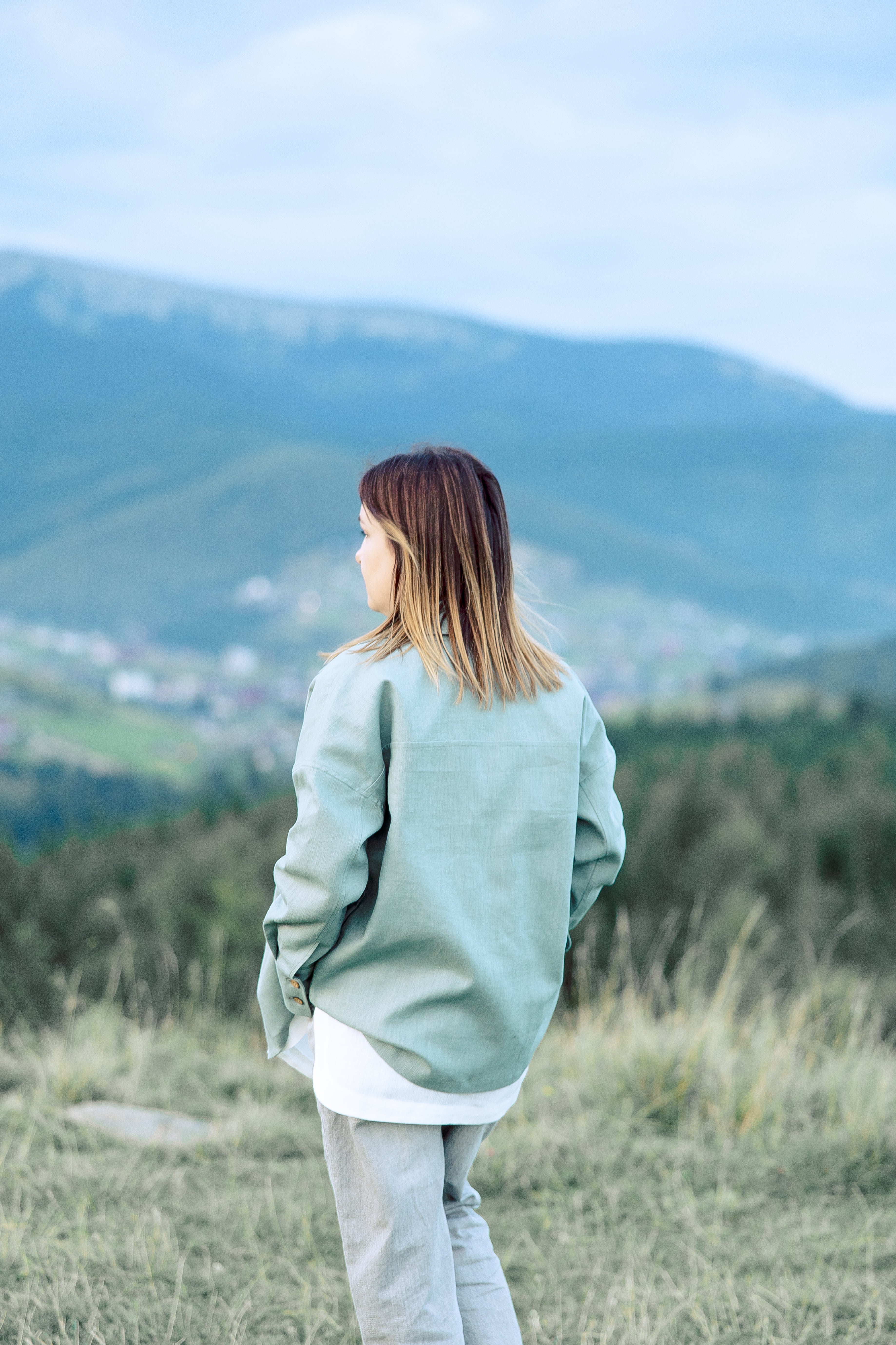 Minimalist women overshirt in soft green shade made of natural fibers