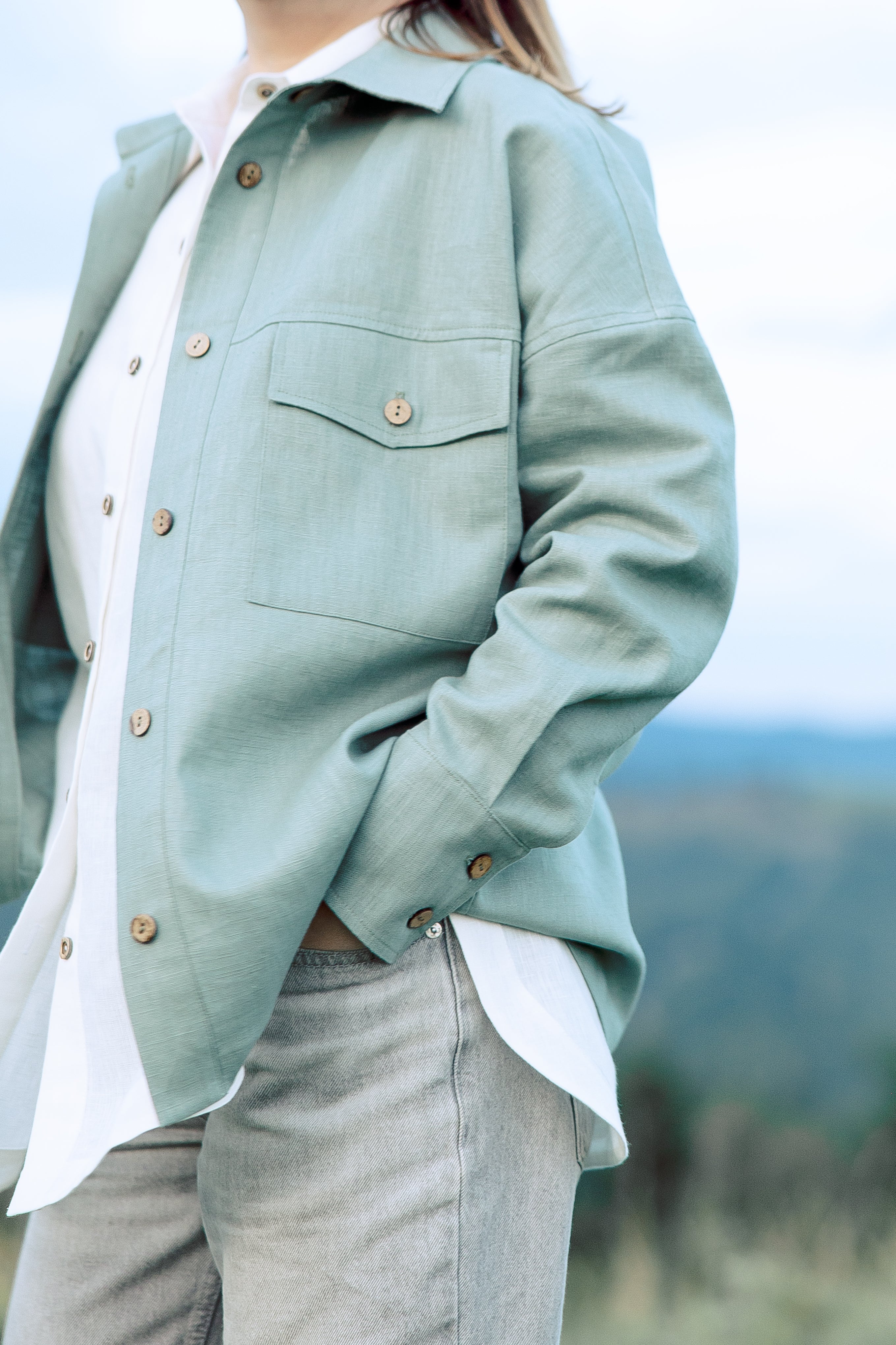 Close-up detail of women nettle jacket with natural buttons and dense texture