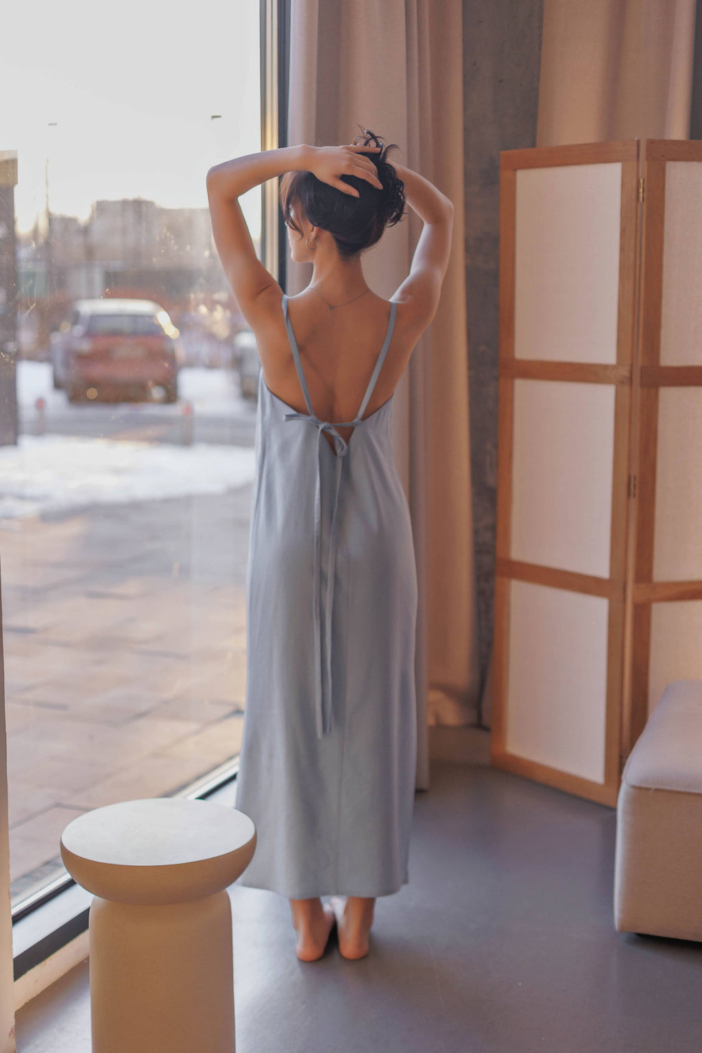 Back view of a breathable nettle and linen sundress with adjustable tie straps