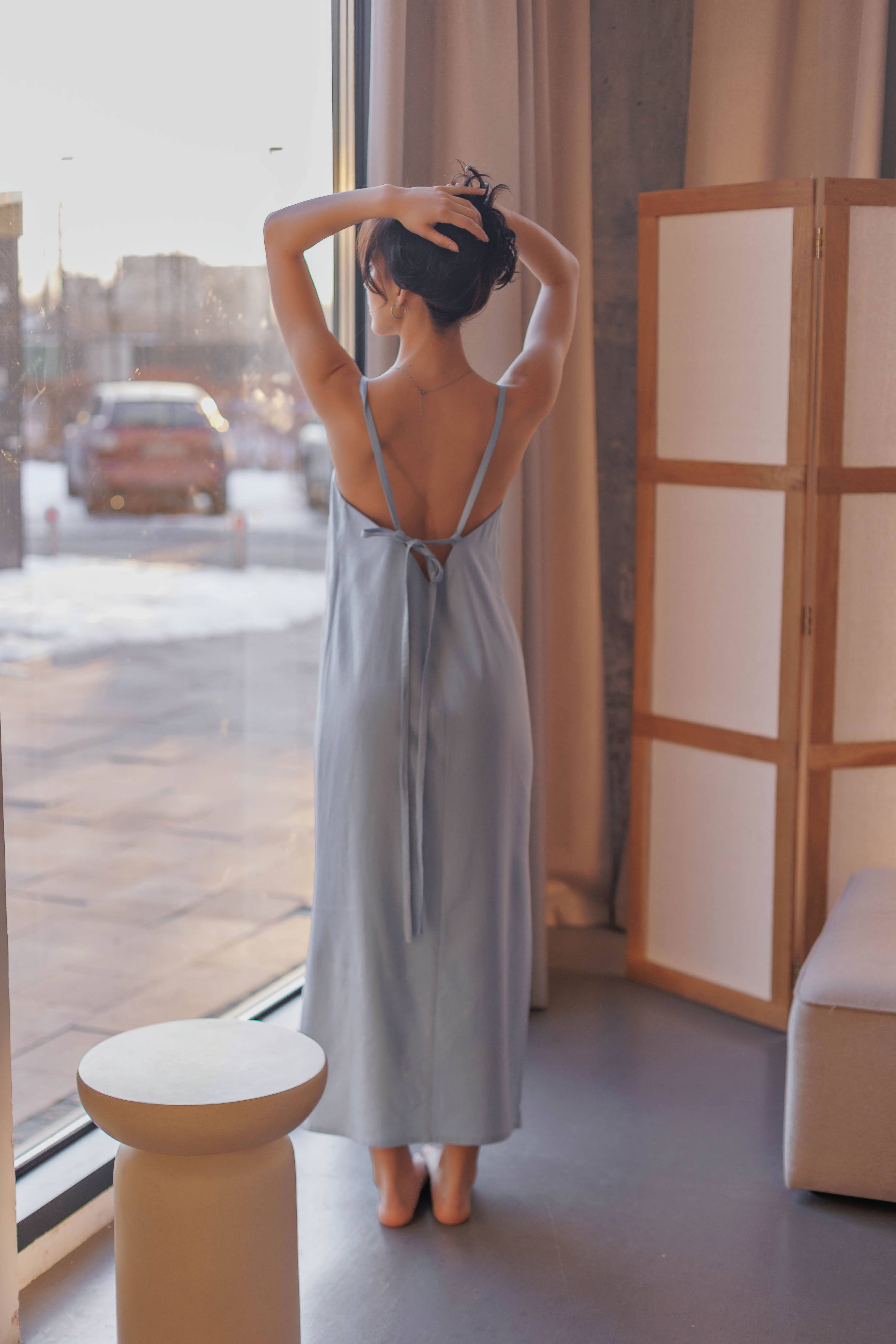 Back view of a breathable nettle and linen sundress with adjustable tie straps