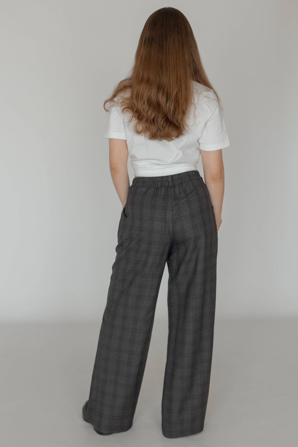 Back view of women’s wool plaid trousers with elasticated waistband