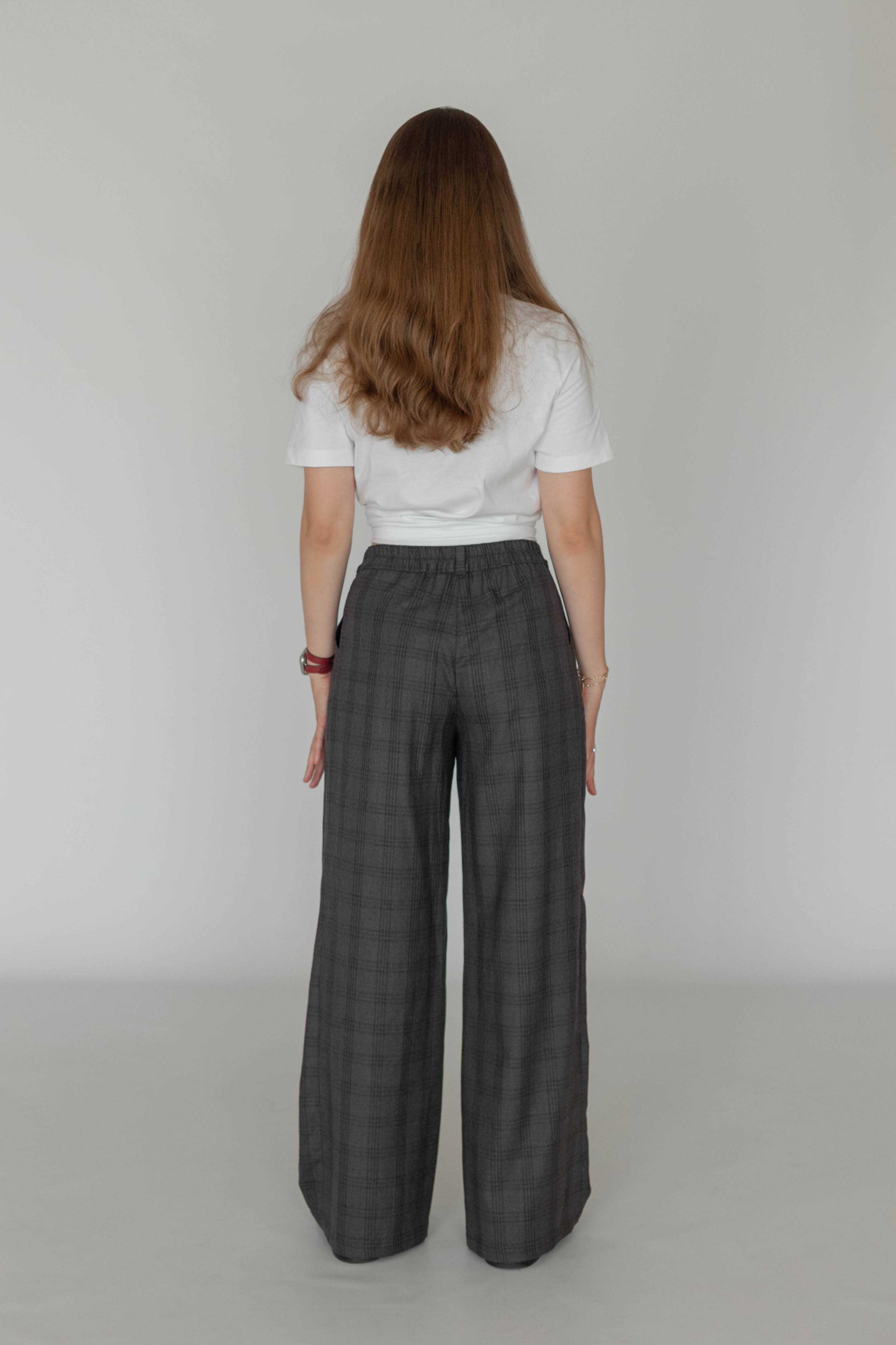 Women’s wool checked trousers styled with a minimalist shirt